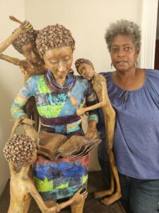 Linda Mickens with sculpture